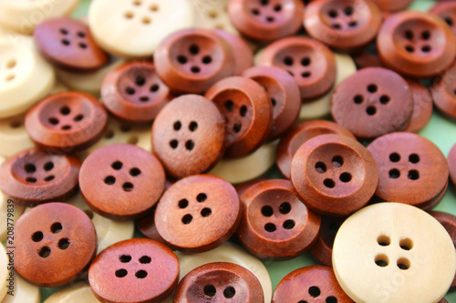Wooden Craft Buttons on a wooden background.