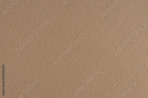 close up of a woolen fabric of beige color.