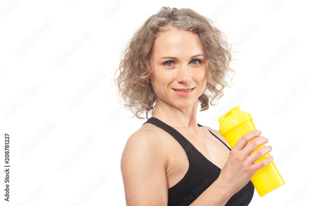 Portrait of happy smiling young woman in fitness wear with bottle of water Portrait of happy smiling young woman in fitness wear with bottle of water