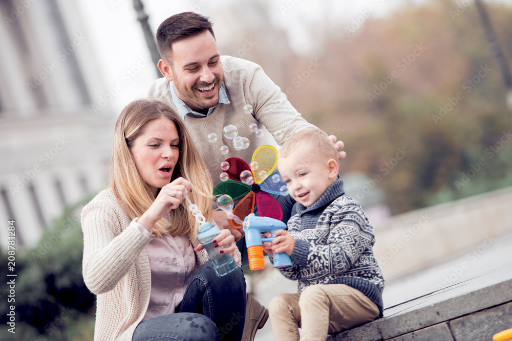 Family is playing in the city
