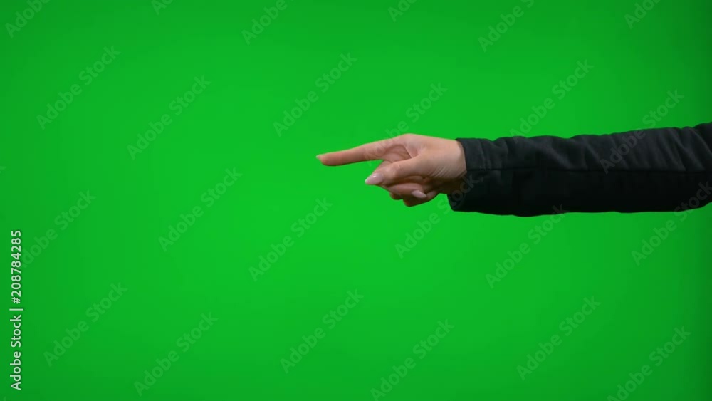 Young female hand gesturing in front of green screen presenting pointing thumb up snapping clapping Young female hand gesturing in front of green screen presenting pointing thumb up snapping clapping