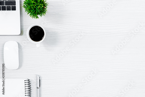 White wood office desk table and equipment for working with black coffee  in top view and flat ray concept.