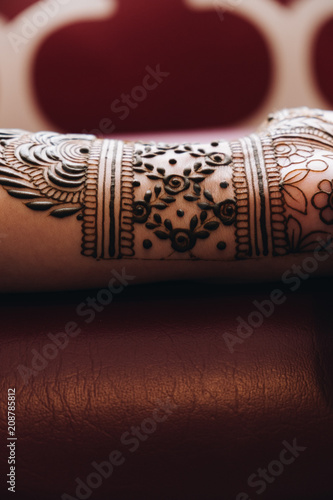 Bridal henna being applied to hands