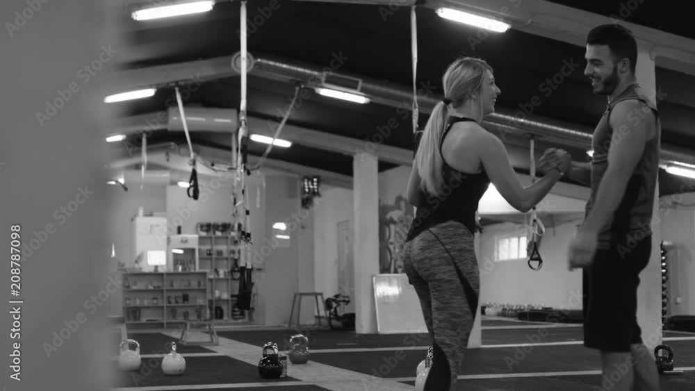 Persona trainer motivating woman for next exercise. Persona trainer motivating woman for next exercise.
