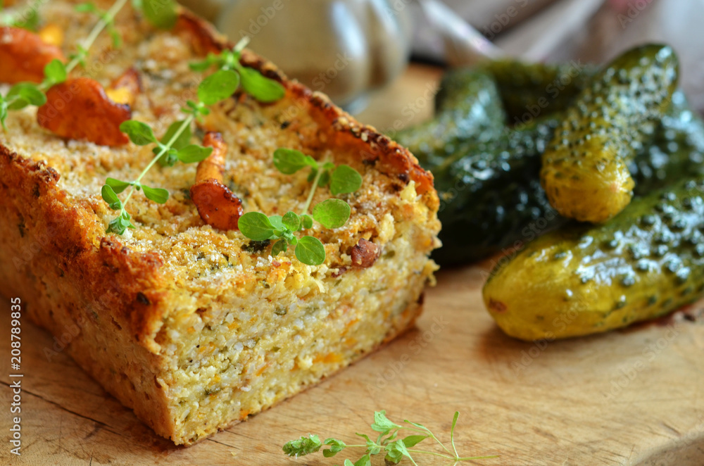Vegetarian lentil pate on a wooden board. Freshly pickled cucumbers on a wooden board Vegetarian lentil pate on a wooden board. Freshly pickled cucumbers on a wooden board
