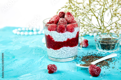 Healthy chia pudding with raspberries in glass