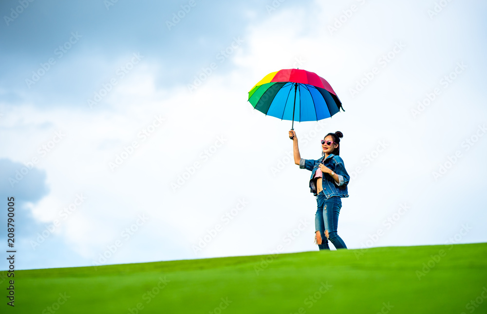 Asian women with multi-color umbrella