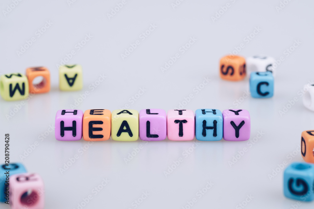 Obraz premium Healthy word text written on colorful cube with bokeh cube word block background