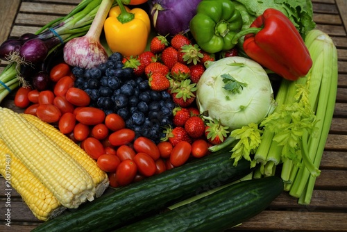 Organic  fruits and vegetables on a wooden table 