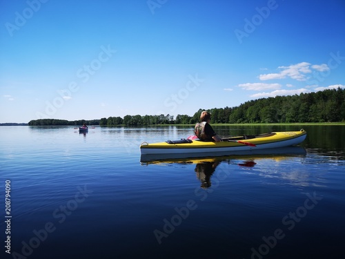 Kayaks on a calm blue lake