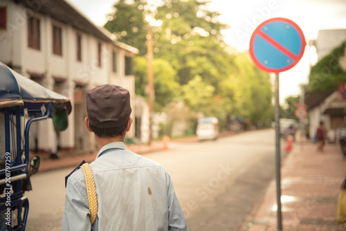 security guard man of laos standing on side road and looking forward © vphinit