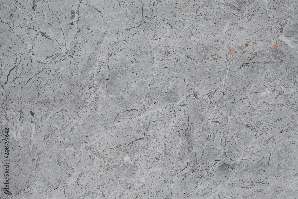 Naklejka premium Fragment of stone texture with scratches and cracks. Natural Background.