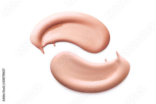 Makeup foundation cosmetic smear cream isolated on white background. Light beige liquid foundation sample smear