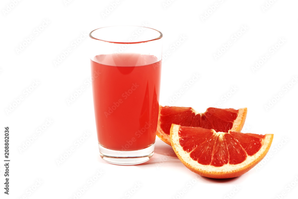 Fresh grapefruit juice with mint in a glass cup isolated on white background. Grapefruit fresh and juice on a white background, view of the shu, cospore space Fresh grapefruit juice with mint in a glass cup isolated on white background. Grapefruit fresh and juice on a white background, view of the shu, cospore space