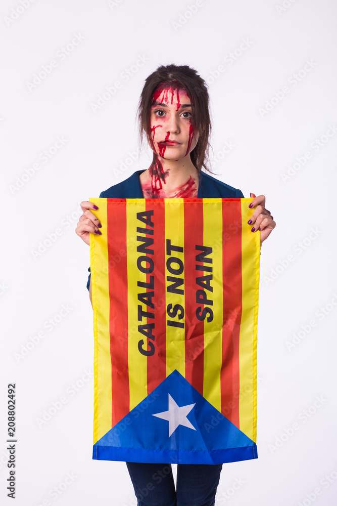 Woman was victim of riots of catalan protesting for spanish government decision about referendum of independence of catalunya