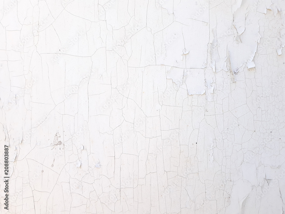 shabby old flaky plaster wall background. white damaged crackled paint. weathered worn out surface. copyspace concept