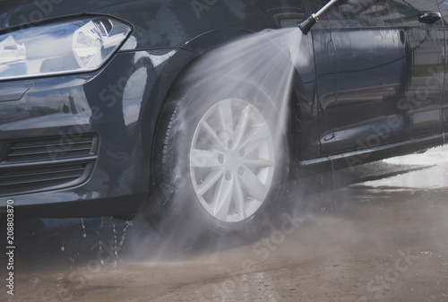Car wash using high pressure water jet. © M-Production