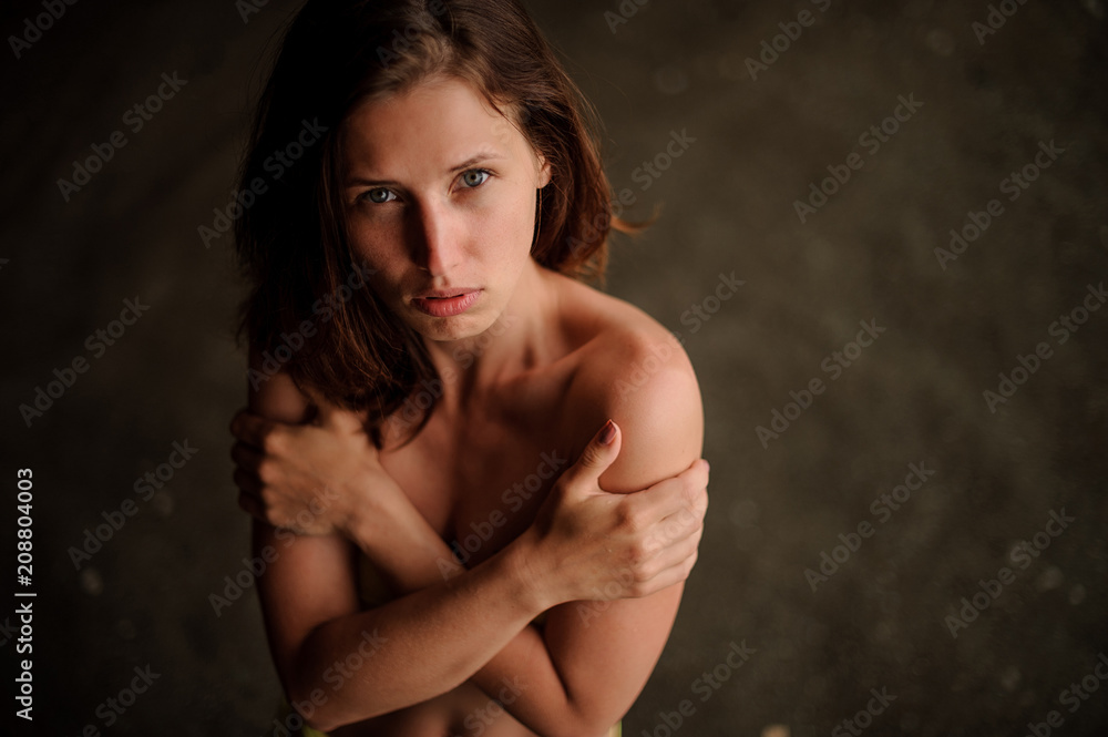 Top view of young sexy topless woman with crossed arms Top view of young sexy topless woman with crossed arms