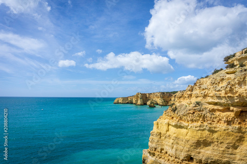 View of beautiful Marinha beach with crystal clear turquoise water near Carvoeiro town, Algarve region, Portugal