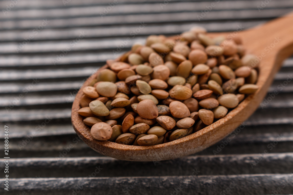 raw lentils on a wooden rustic background raw lentils on a wooden rustic background