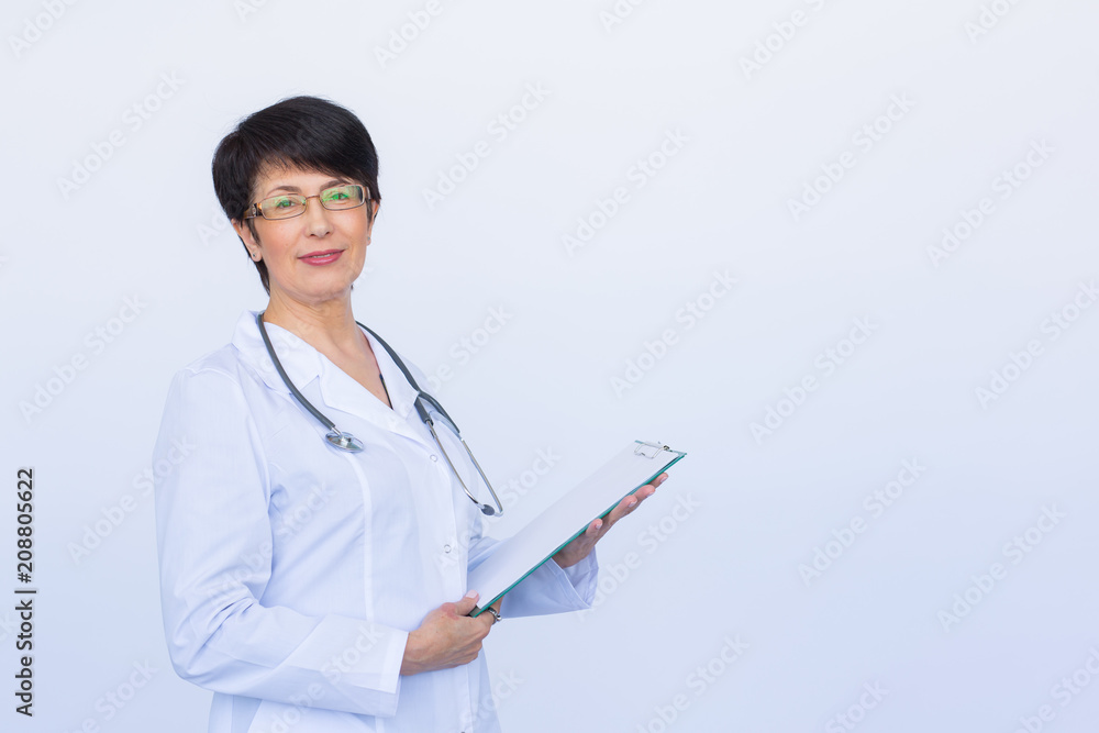 Medical doctor writing prescription over white background with copy space Medical doctor writing prescription over white background with copy space