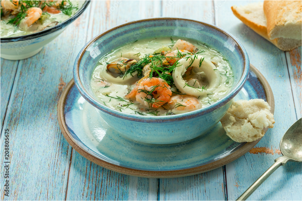 Creamy seafood stew garnished with fresh dill