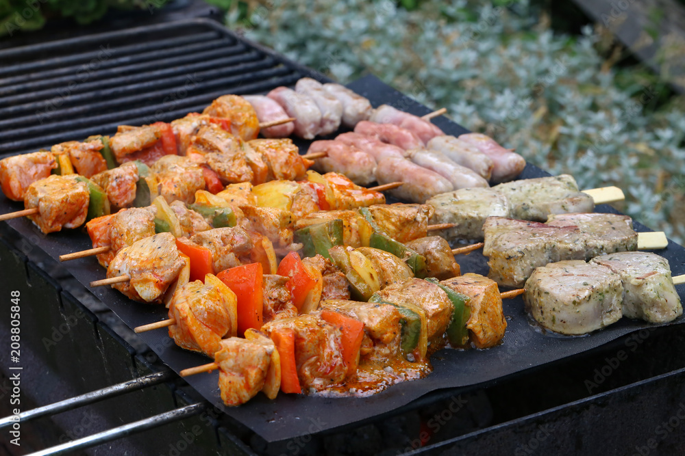Meat with vegetables grilled on a grill