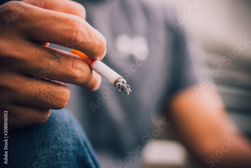 Fotografie Asian stress handsome man smoking,Thailand people,Depressed man concept,He worry