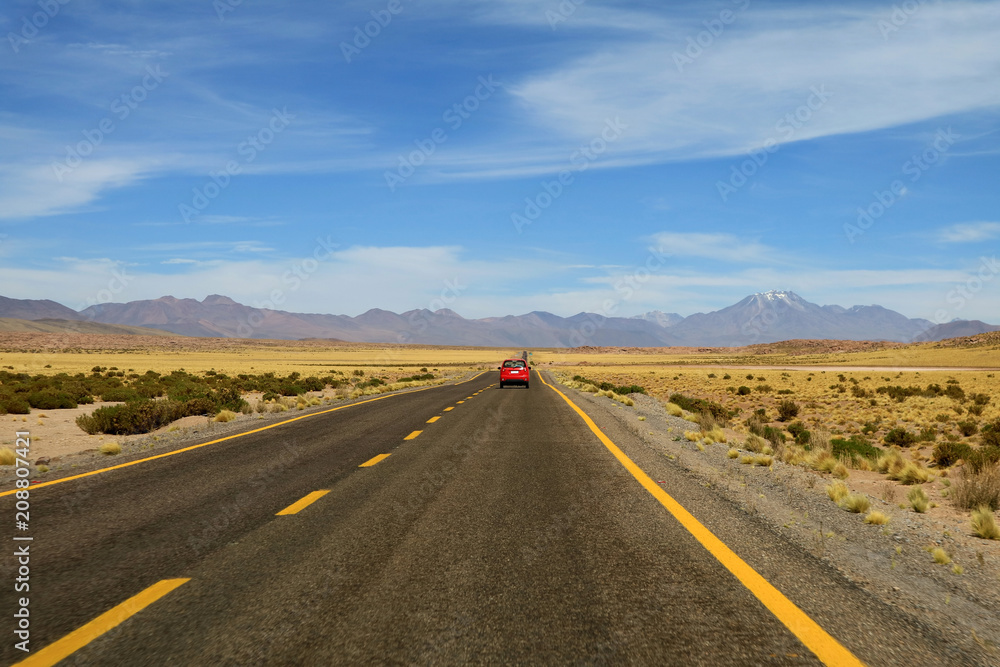 Driving on the high altitude desert road of Atacama desert in northern Chile, South America Driving on the high altitude desert road of Atacama desert in northern Chile, South America