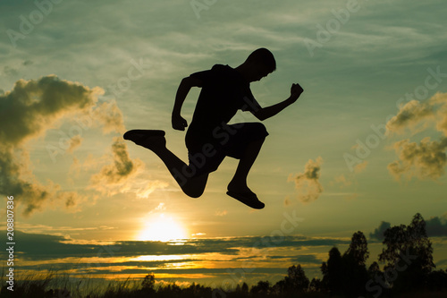 Boy jumping in the air