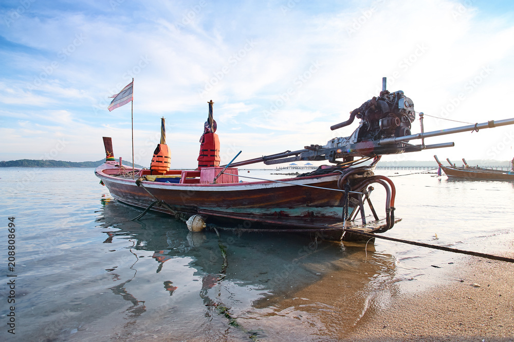 Beautiful landscape with traditional longtail boat on the beach. Phuket, Thailand. Beautiful landscape with traditional longtail boat on the beach. Phuket, Thailand.