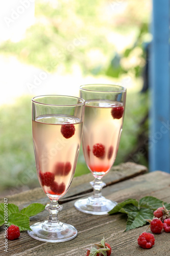 White wine with fresh raspberries. raspberry cocktail