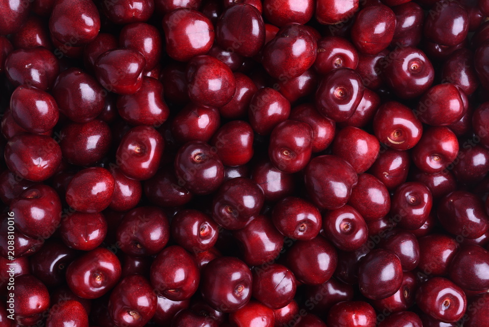 Fresh sweet cherry fruit on the market as background Fresh sweet cherry fruit on the market as background