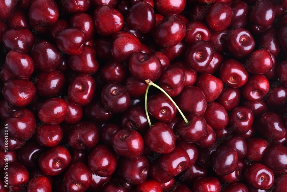 Fresh sweet cherry fruit on the market as background Fresh sweet cherry fruit on the market as background