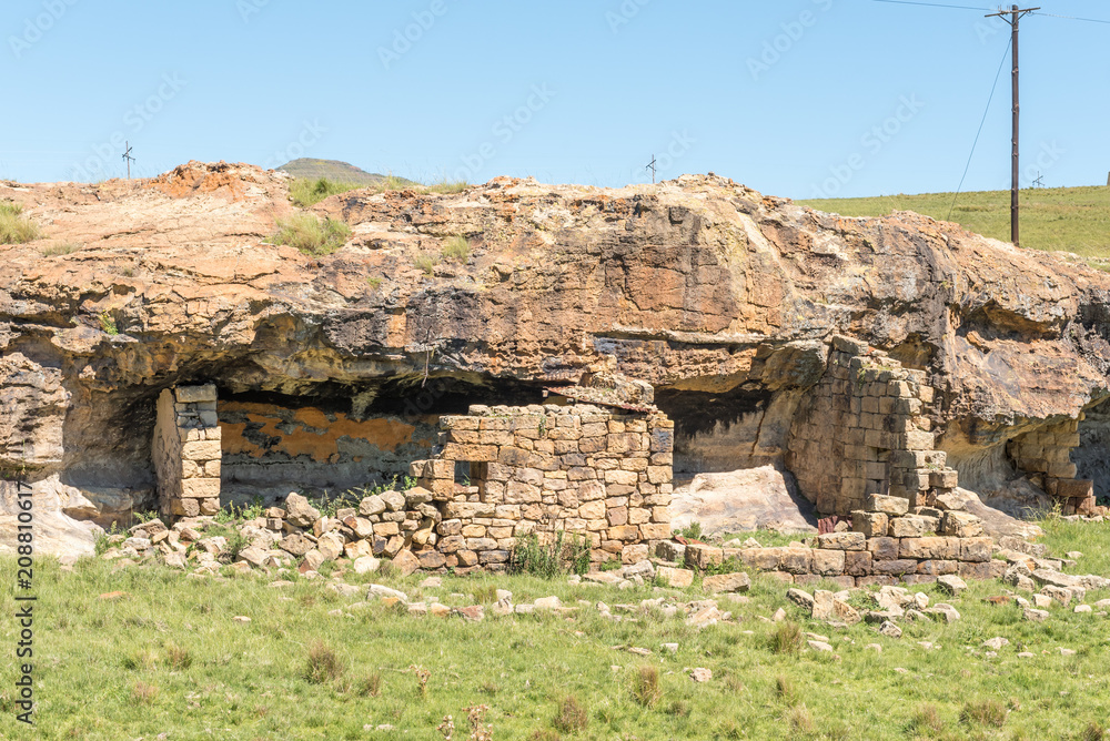 Ruin of a shelter, built underneath a rock overhang Ruin of a shelter, built underneath a rock overhang