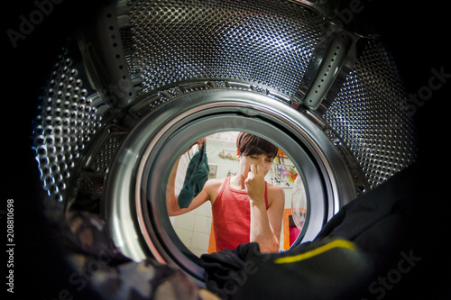 woman viewed from a washing machine