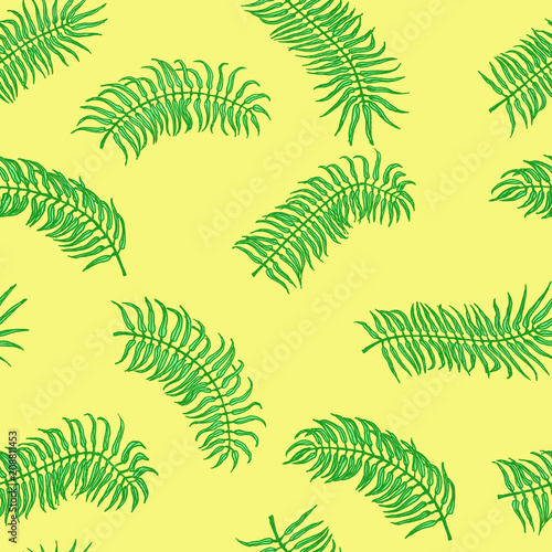 Seamless tropical pattern. Palm leaves on the yellow background
