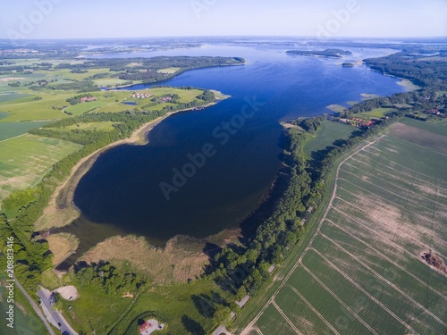 Aerial view of beautiful landscape of lake district, Pniewskie Lake in the foreground, next Mamry Lake and Upalty - the biggest island of Mazury region, Poland