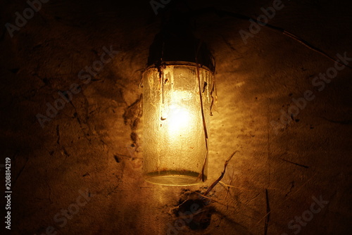 old dirty lamp glowing in the dark 