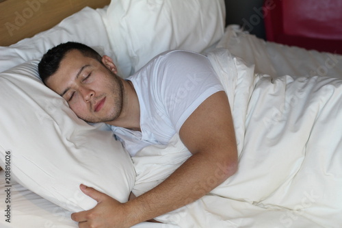 Handsome ethnic male sleeping comfortably