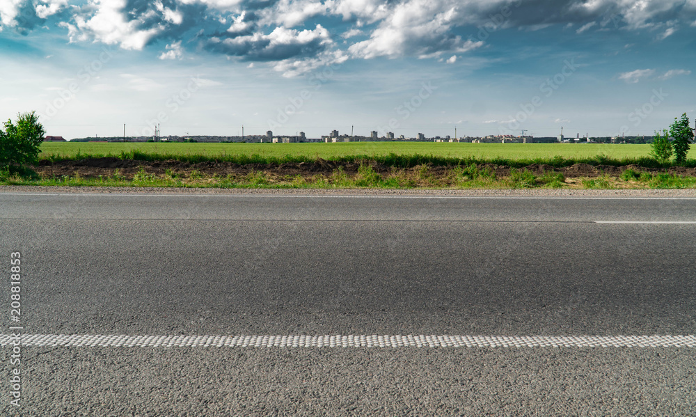 Fototapeta premium Highway overpass motion blur with city skyline background . Sunset scene city, road, asphalt, highway, landscape, sky, cityscape, downtown, fast, freeway, journey
