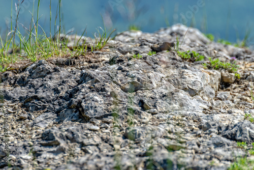 Rocks on a mountain overgrown with grass © Marcus Beckert