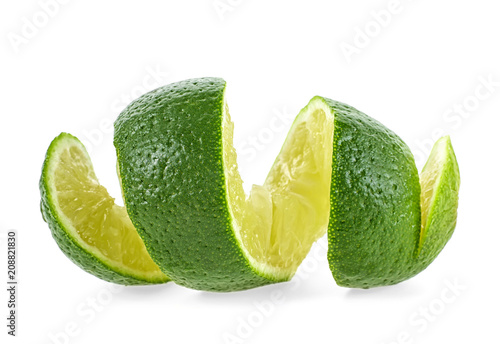 Cut lime in shape of a spiral on white background
