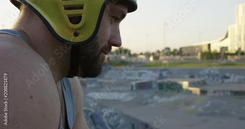 BMX rider focusing at skatepark -  deep breaths preparing- close up photo