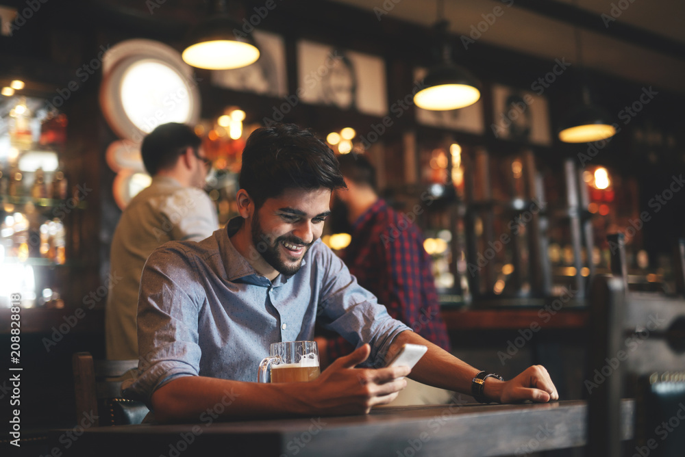 The guys in the pub are drinking beer The guys in the pub are drinking beer