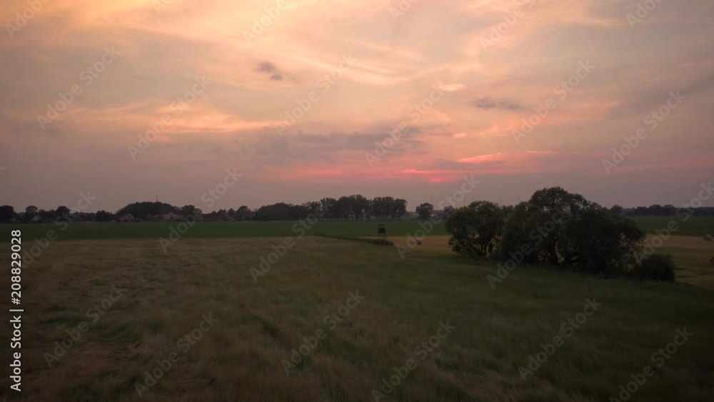 sunset over a summer landscape sunset over a summer landscape