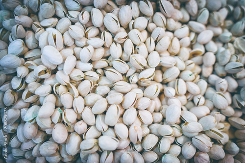 Pistachios for sale on market. Agriculture background. Close-up. Top view. photo