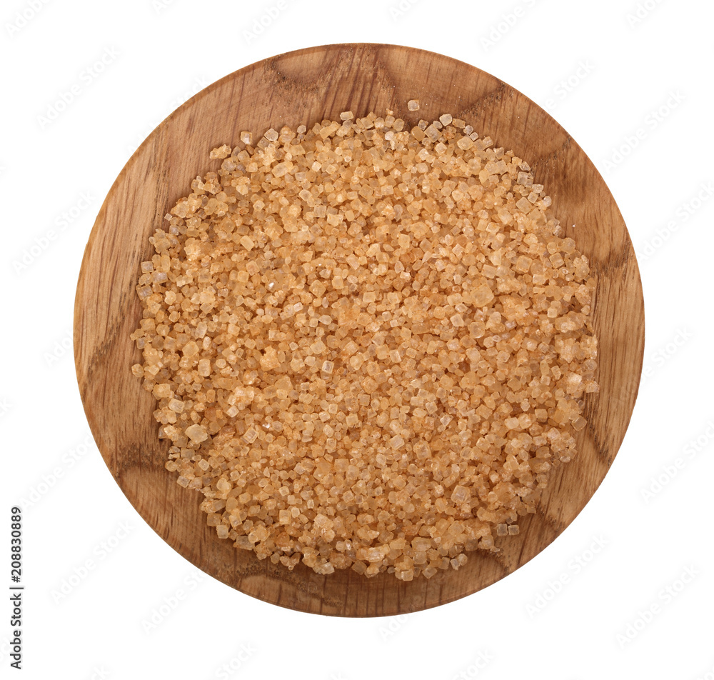 brown granulated sugar in wooden bowl isolated on white background. Top view. Flat lay brown granulated sugar in wooden bowl isolated on white background. Top view. Flat lay