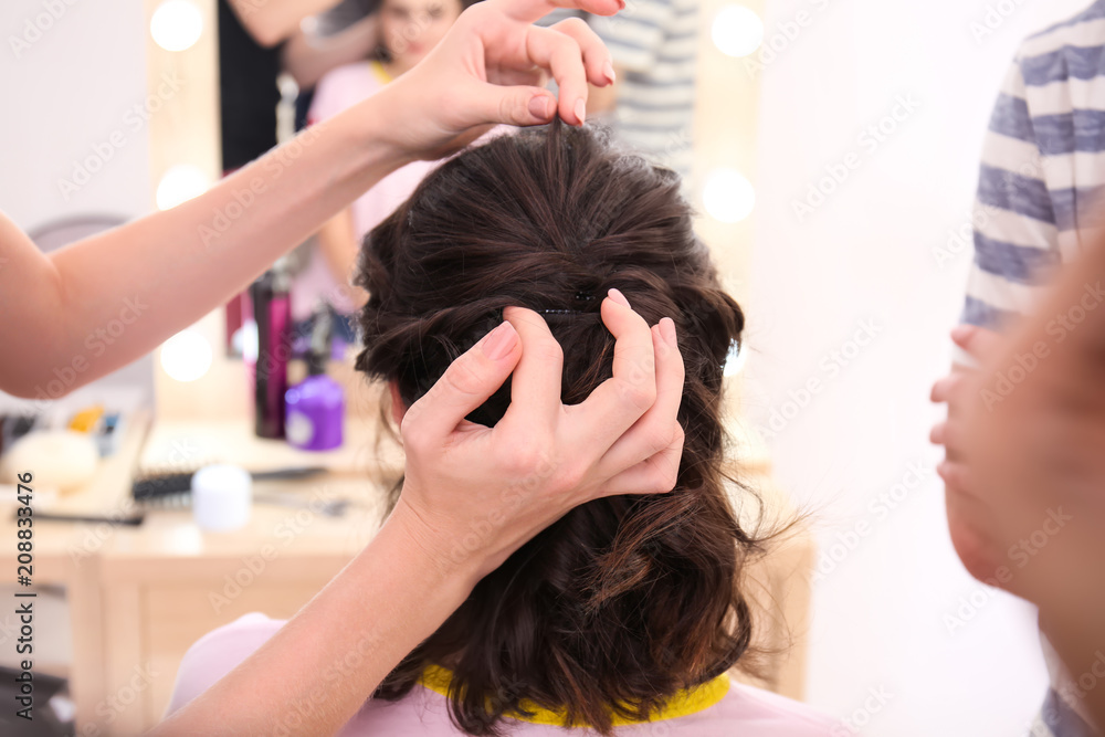 Professional hairdresser working with client in salon. Apprenticeship concept Professional hairdresser working with client in salon. Apprenticeship concept