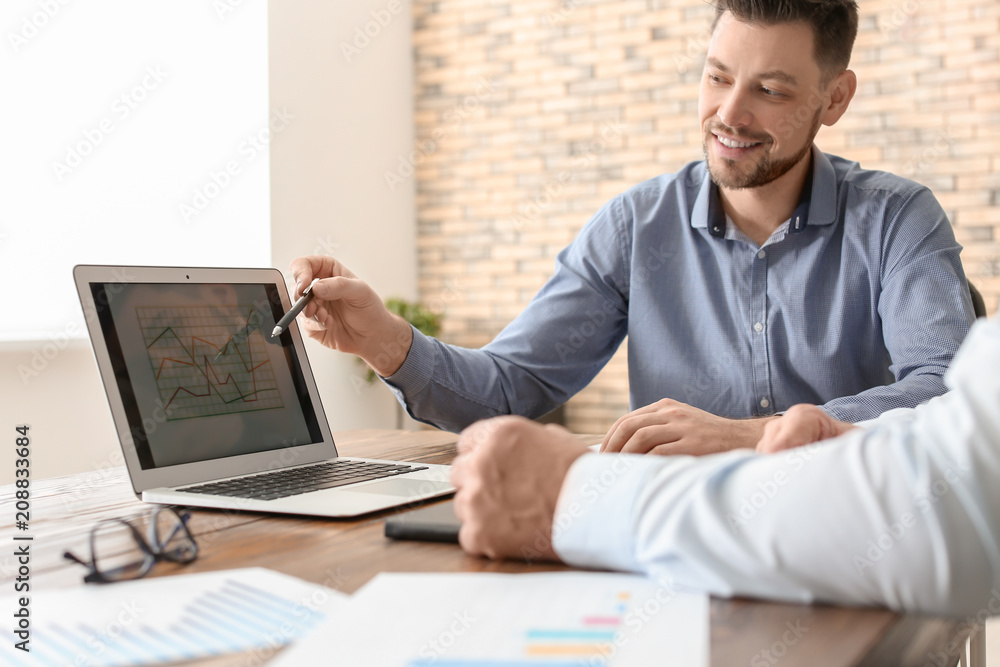 Male brokers working in office. Finance trading concept Male brokers working in office. Finance trading concept
